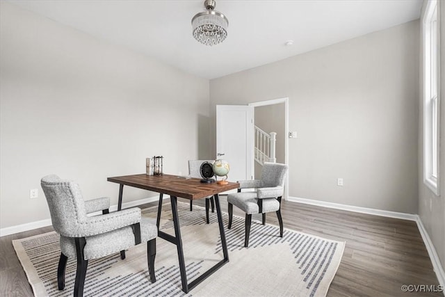 home office with dark wood-style floors and baseboards