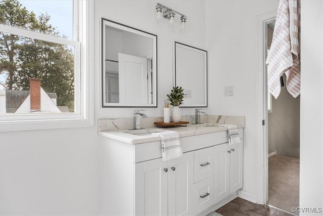 full bath featuring a sink and double vanity