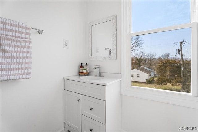 bathroom with vanity and a healthy amount of sunlight