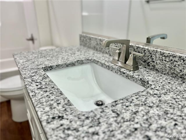 details featuring toilet and vanity