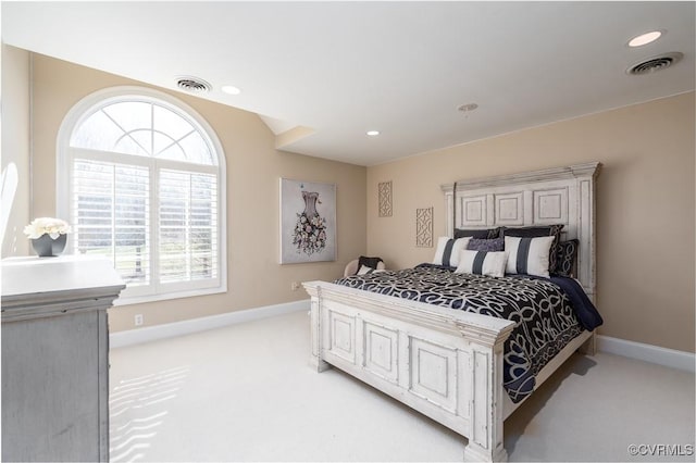 bedroom featuring light colored carpet