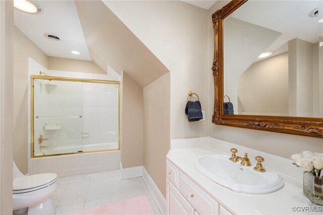 full bathroom with vaulted ceiling, shower / bath combination with glass door, vanity, toilet, and tile patterned floors