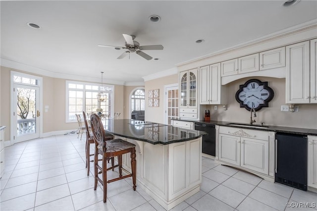 kitchen with sink, crown molding, a center island, hanging light fixtures, and black dishwasher