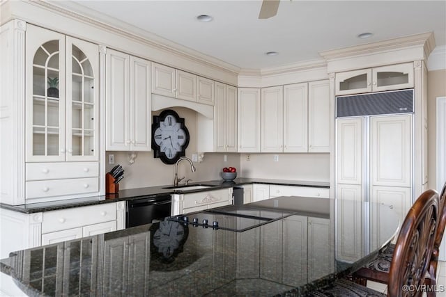 kitchen with black dishwasher, dark stone countertops, sink, white cabinets, and ceiling fan