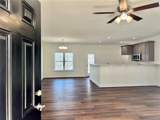 423 Bradshaw Rd, Rice, VA 23966 - kitchen featuring recessed lighting, stainless steel microwave, ceiling fan with notable chandelier, baseboards, and dark wood-style floors