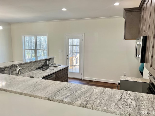 423 Bradshaw Rd, Rice, VA 23966 - kitchen with light stone countertops, dark brown cabinets, crown molding, and recessed lighting