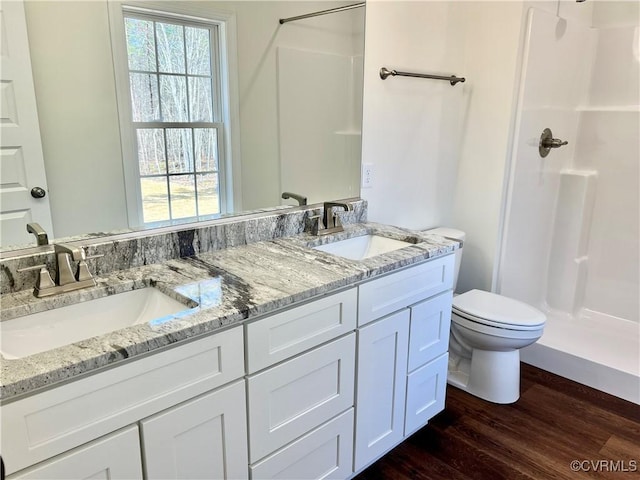 423 Bradshaw Rd, Rice, VA 23966 - bathroom with a sink, a stall shower, toilet, and wood finished floors