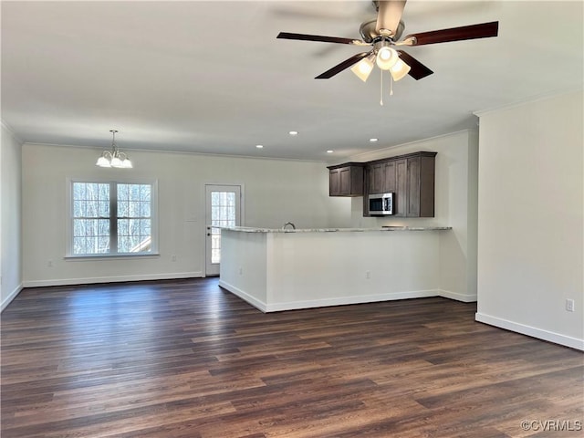 423 Bradshaw Rd, Rice, VA 23966 - kitchen featuring baseboards, dark wood-style flooring, ornamental molding, and stainless steel microwave