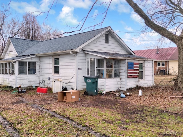 back of house with a sunroom