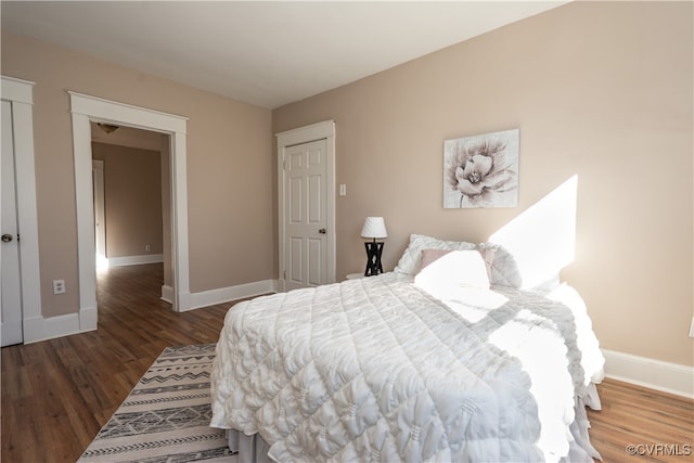 bedroom featuring dark hardwood / wood-style flooring