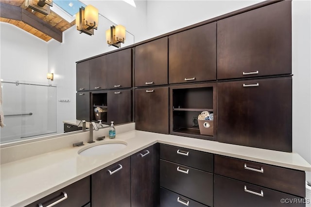 bathroom featuring lofted ceiling, vanity, and wooden ceiling