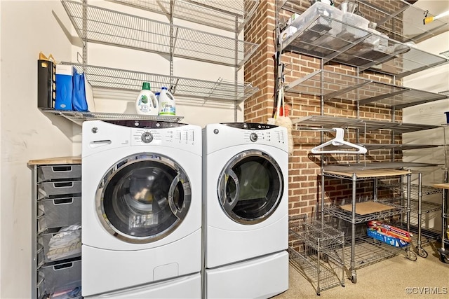 clothes washing area with washer and dryer