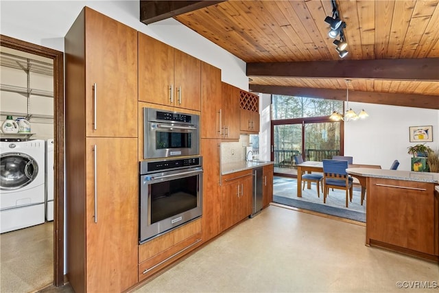 kitchen featuring vaulted ceiling with beams, decorative light fixtures, washer and dryer, wooden ceiling, and a notable chandelier