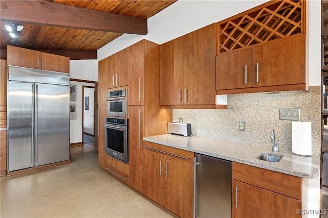 kitchen featuring sink, backsplash, stainless steel appliances, light stone counters, and beamed ceiling