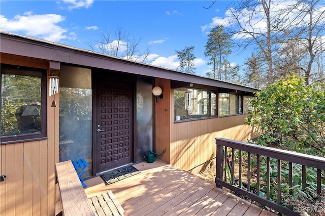 doorway to property with a wooden deck