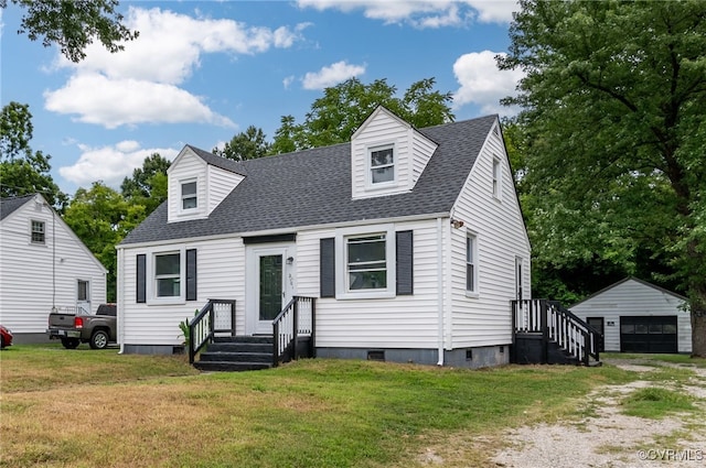 cape cod home featuring an outbuilding, a garage, and a front lawn