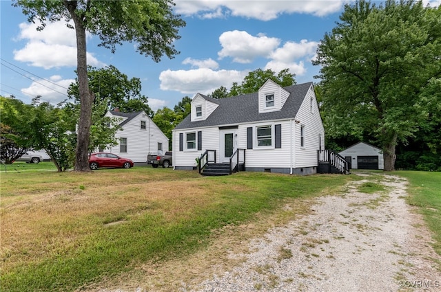 cape cod house with a garage, an outdoor structure, and a front lawn