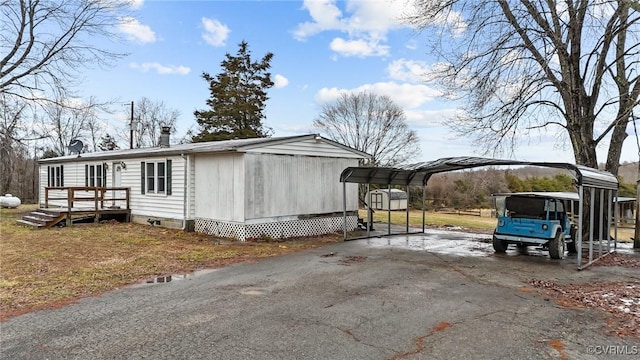 exterior space featuring a carport