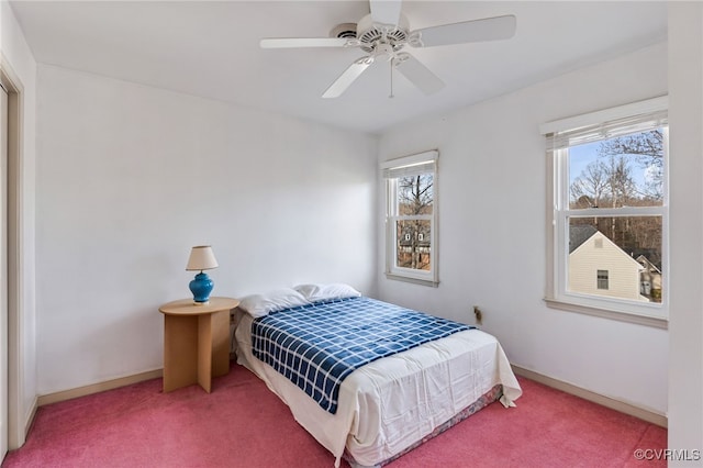 bedroom with ceiling fan and carpet floors