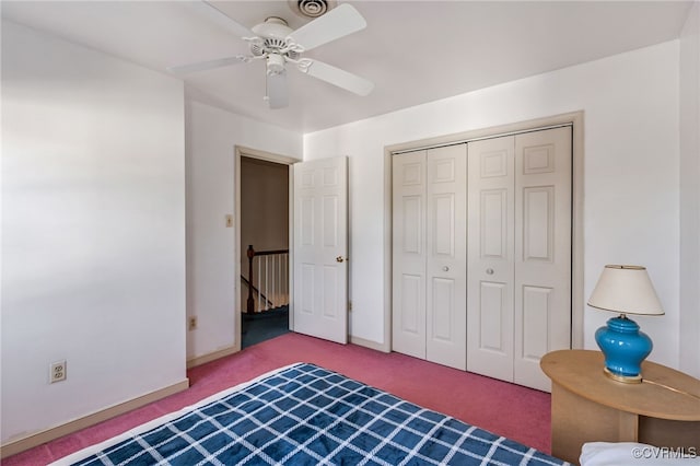 carpeted bedroom featuring ceiling fan and a closet