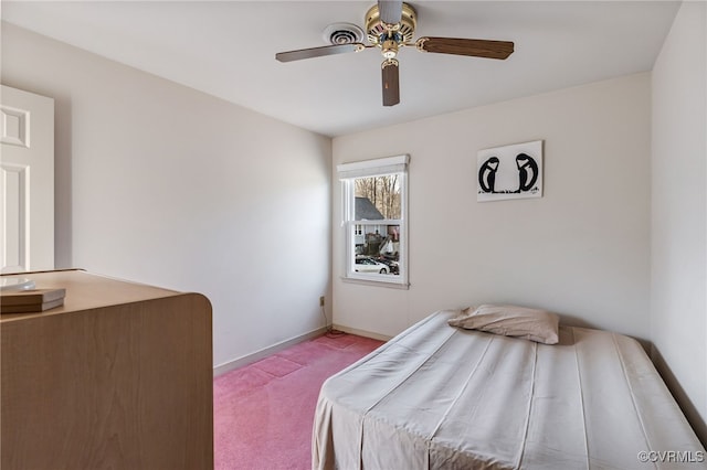 bedroom featuring light colored carpet and ceiling fan