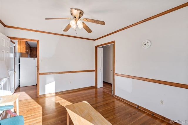 unfurnished room with ornamental molding, ceiling fan, and light hardwood / wood-style floors