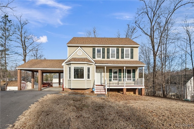 view of front of home with a carport and covered porch