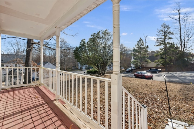 wooden terrace with a porch