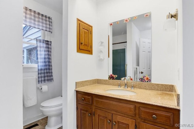 1270 Riverview Dr, West Point, VA 23181 - bathroom featuring vanity, toilet, and baseboards