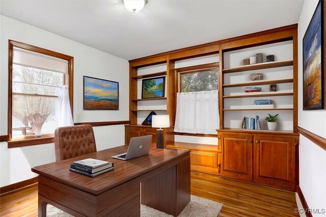 1270 Riverview Dr, West Point, VA 23181 - home office featuring light wood finished floors, healthy amount of natural light, and baseboards