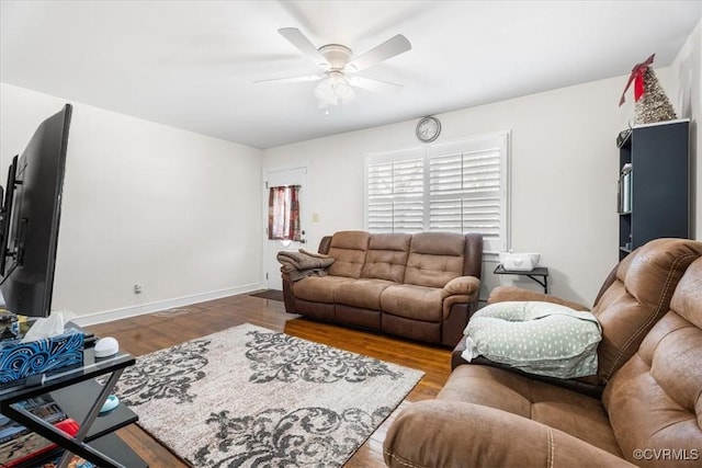 living room with hardwood / wood-style floors and ceiling fan