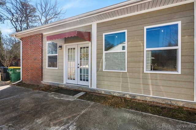 doorway to property featuring french doors and a patio area