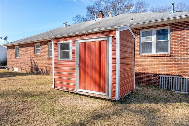 view of outdoor structure with a lawn