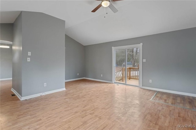 unfurnished living room with ceiling fan, lofted ceiling, and light wood-type flooring