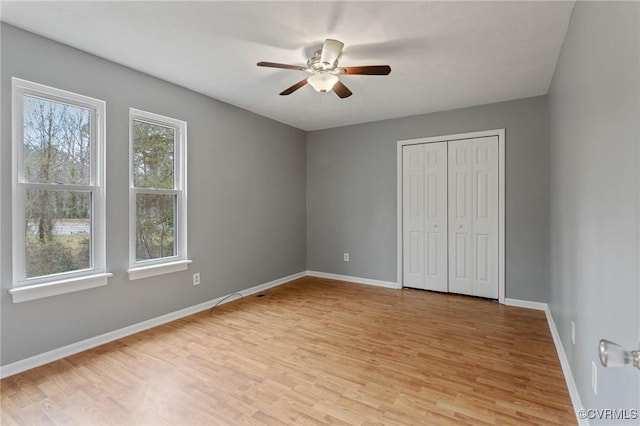 unfurnished bedroom featuring a closet, ceiling fan, and light hardwood / wood-style flooring