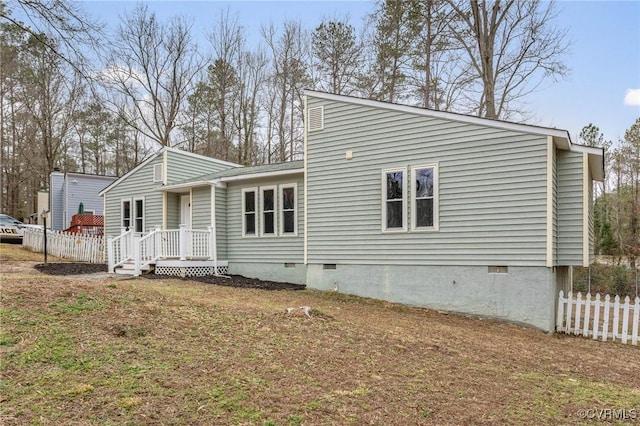 rear view of house with a yard