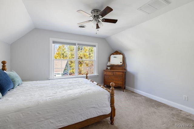 bedroom featuring ceiling fan, lofted ceiling, and light carpet