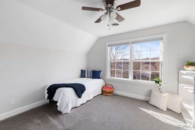 carpeted bedroom with vaulted ceiling and ceiling fan