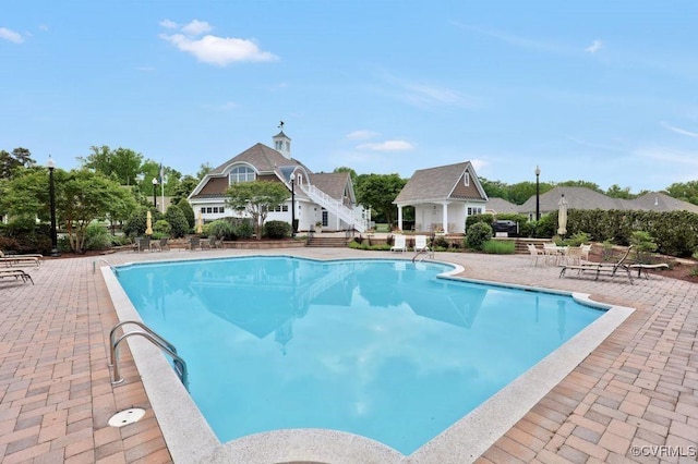 view of swimming pool with a patio area