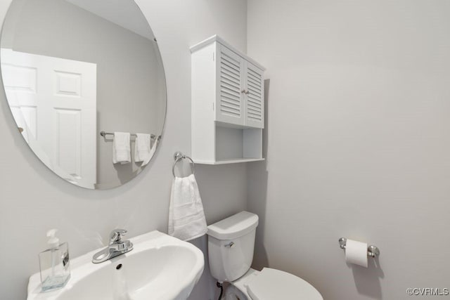 bathroom featuring sink and toilet