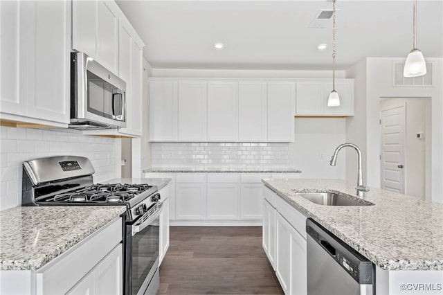 3817 Maze Runner Dr, Midlothian, VA 23112 - kitchen featuring white cabinetry, appliances with stainless steel finishes, a kitchen island with sink, and sink