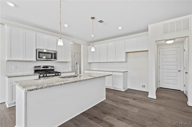 3817 Maze Runner Dr, Midlothian, VA 23112 - kitchen featuring white cabinetry, appliances with stainless steel finishes, sink, and a center island with sink