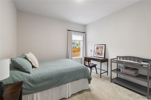 bedroom with light colored carpet