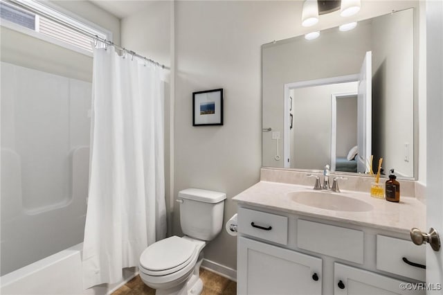 full bathroom featuring vanity, shower / tub combo, and toilet