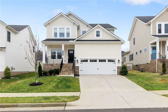 craftsman inspired home with a garage, a front yard, and covered porch