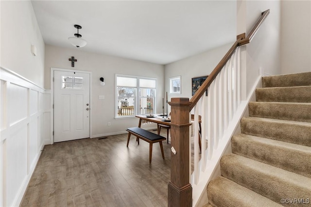 foyer with wood-type flooring