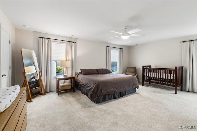 carpeted bedroom with ceiling fan