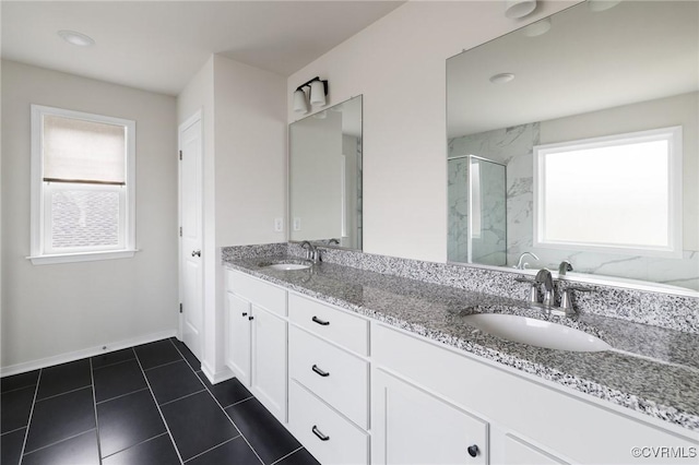 bathroom featuring vanity and an enclosed shower