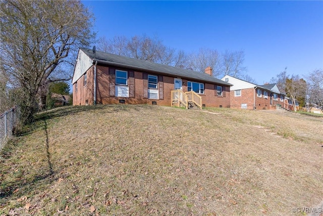 single story home featuring a front lawn