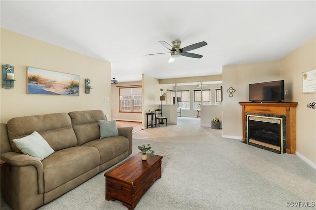 living room featuring light colored carpet and ceiling fan